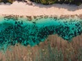 Top view of tropical beach with turquoise sea water and reef, aerial drone shot Royalty Free Stock Photo