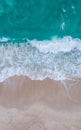 Top view at a tropical beach with waves and blue ocean Drone aerial view at Freedom beach in Phuket