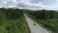 Top view of truck driving along highway on summer day. Scene. White truck is driving on country highway with green Royalty Free Stock Photo