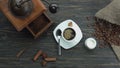 Top view of the turkish coffee poured from copper jezva into the white cup