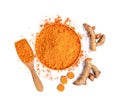 Top view of turmeric roots and turmeric powder in wooden bowl Royalty Free Stock Photo