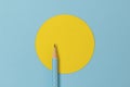 Top view of turquoise polka dot pencil on colorful paper combine with yellow circle Royalty Free Stock Photo