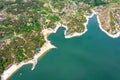 Top view of the turquoise water of a mountain lake. Clean clear water with streaks on the bottom. Patterns from a