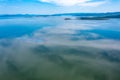 Top view of the turquoise water of a mountain lake. Clean clear water with streaks on the bottom. Patterns from a Royalty Free Stock Photo