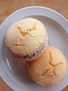 Two Alfajores, traditional Latin American sweets served on a white plate