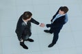 Top view of a two businessman shaking hands - Welcome to business. Royalty Free Stock Photo