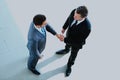 Top view of a two businessman shaking hands - Welcome to business. Royalty Free Stock Photo