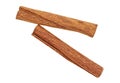 Top view of two cinnamon sticks on white background, close-up. Cassia Royalty Free Stock Photo