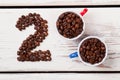 Top view two cups filled with coffee beans. Royalty Free Stock Photo