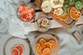 Top view of two glasses with dried pumpkins and bananas with a background of blurred dried fruits on wooden boards Royalty Free Stock Photo