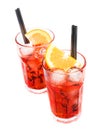 Top of view of two glasses of spritz aperitif aperol cocktail with orange slices and ice cubes isolated on white