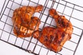 Top view of two Grilled chicken legs soy sauce, coriander, and garlic seasoning on a grilling rack Royalty Free Stock Photo