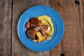 Top view of two grilled lamb chops and potatoes served on pea puree with a mint sauce Royalty Free Stock Photo