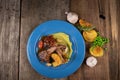 Top view of two grilled lamb chops and potatoes served on pea puree with a mint sauce Royalty Free Stock Photo