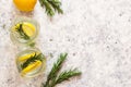 Top view of two jars of lemonade with ice, lemon and rosemary. Copy space, flat lay. Refreshing summer drinks. Selective Royalty Free Stock Photo