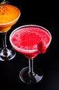 Top view, two mango and strawberry margarita, orange and red alcoholic cocktail with decoration of salt of the glass Royalty Free Stock Photo