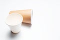 Top view of two paper coffee cups on white studio background. Royalty Free Stock Photo