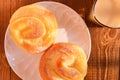 Top view two pieces bread and cup of soy  milk in a sunny morning Royalty Free Stock Photo