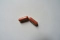 Top view of 2 pink capsules of PQQ dietary supplement Royalty Free Stock Photo