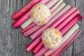 Top View on two Rhubarb muffins in paper cups on a rhubarb perioles Royalty Free Stock Photo