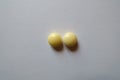 Top view of 2 round yellow pills of xylitol Royalty Free Stock Photo