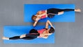 Top view of women on yoga mat at fitness class Royalty Free Stock Photo