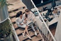 Top view of two young modern women in smart casual wear