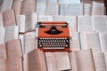 Top view typewriter is on many open books