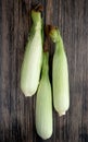 top view of uncooked corns on wooden background 1