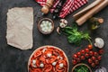 top view of uncooked pizza with ingredients and blank paper Royalty Free Stock Photo