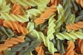 Top View Of Uncooked Three-Color Spiral Shaped Pasta or Fusilli for Texture Royalty Free Stock Photo