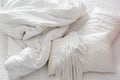 Top view of an unmade bed in a bedroom with crumpled bed sheet. Royalty Free Stock Photo