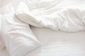 Top view of an unmade bed with crumpled bed sheet. Royalty Free Stock Photo