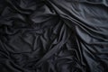 Top view of an unmade black bed with a crumpled sheet Royalty Free Stock Photo