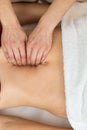 Hands of physiotherapist checking diastasis recti on belly of postpartum woman Royalty Free Stock Photo