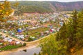 Top view of the Ural village STAROSUBHANGULOVO surrounded by the river Belaya among mountain peaks and taiga. Royalty Free Stock Photo