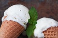 Top view vanilla ice cream in waffle cone with mint leaves on a