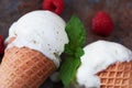 Top view vanilla ice cream in waffle cone with mint leaves on a