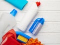 Top view variety of cleaning products on wooden white background : spring cleaning concept Royalty Free Stock Photo