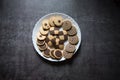 Top view of variety of cookies in a plate on a background Royalty Free Stock Photo