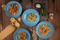 Top view variety of homemade prepared pasta isolated on wooden table