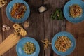 Top view variety of homemade prepared pasta isolated on wooden table