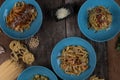 Top view variety of homemade prepared pasta isolated on wooden table