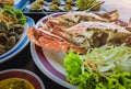 Top view of variety Seafood party table with scallop, cockle, crab, clams, shrimps, crayfish on black background. Seafood platter