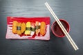 Variety sushi with chopsticks and soy sauce