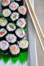 Top view of Variety Sushi Rolls on White Plate Royalty Free Stock Photo