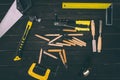 top view of various carpentry tools on dark Royalty Free Stock Photo