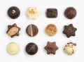 Top view of various chocolate pralines isolated on white background