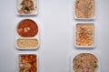 Top view various frozen meal in plastic tray against white background. Royalty Free Stock Photo