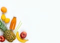 Top view of various fruits and a bottle of freshly squeezed multivitamin juice on a white background. Copy space. Flat lay